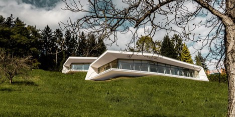 Love Architecture completes house of two halves overlooking an Austrian valley