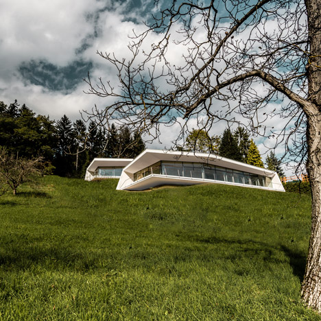 Love Architecture completes house of two halves overlooking an Austrian valley