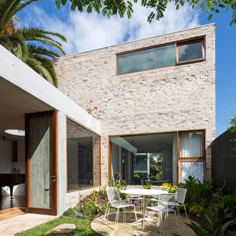 Textured brick and concrete house in Sydney encloses a garden courtyard