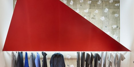 Tokujin Yoshioka installs giant red triangles for Tokyo Issey Miyake store