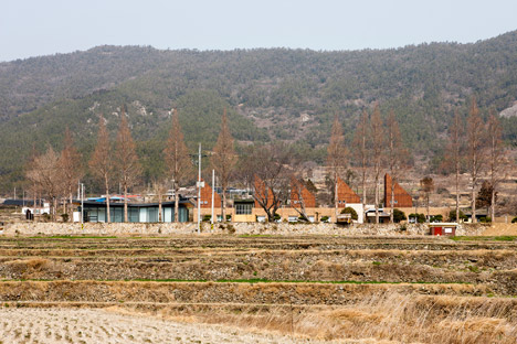 Slow Island Trip Center by OUJAE Architects
