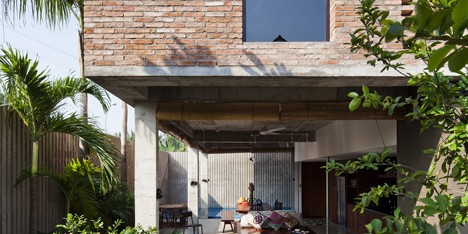 Vietnam house by MM++ Architects features a palm-leaf roof and an open-air living space