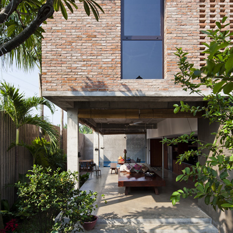 Vietnam house by MM++ Architects features a palm-leaf roof and an open-air living space