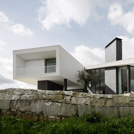 Vidigal House by Contaminar has a V-shaped plan enclosing a triangular garden
