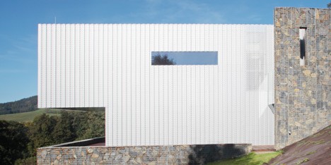 Villa in the Czech mountains combines perforated metal with stone gabions