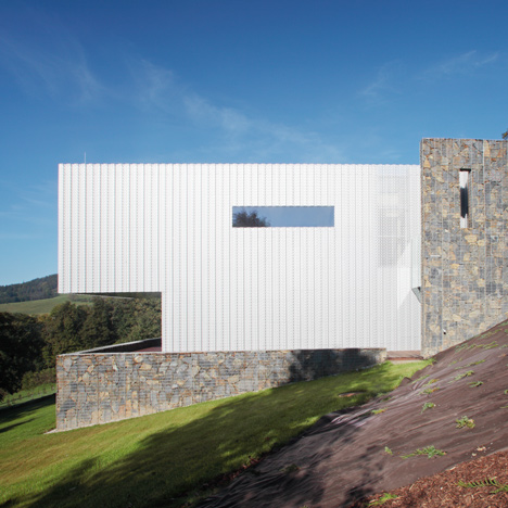 Villa in the Czech mountains combines perforated metal with stone gabions