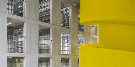 Baukuh’s House of Memory features a decorative facade and a monumental yellow staircase