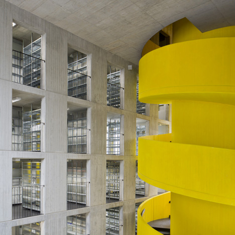 Baukuh’s House of Memory features a decorative facade and a monumental yellow staircase
