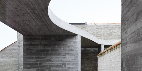 Concrete canopy creates two-storey terrace for home and clinic by Graux & Baeyens
