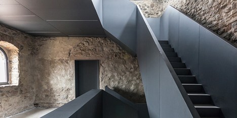 Gianluca Gelmini inserts an angular iron staircase inside a medieval Italian fortress