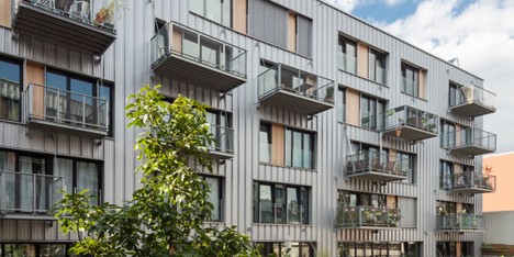 Brutopia is an aluminium-clad apartment complex built by a cooperative in Brussels