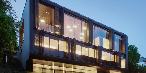 Perforated shutters move mechanically to mask the facade of Archinauten’s House GT