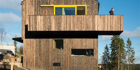Timber-clad home by Schjelderup Trondahl sits on a hill overlooking Oslo