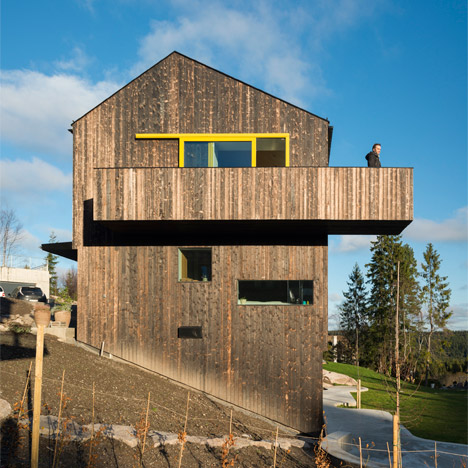Timber-clad home by Schjelderup Trondahl sits on a hill overlooking Oslo