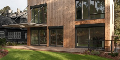 Aketuri Architektai pairs a timber facade with a concrete canopy for House in Vilnius