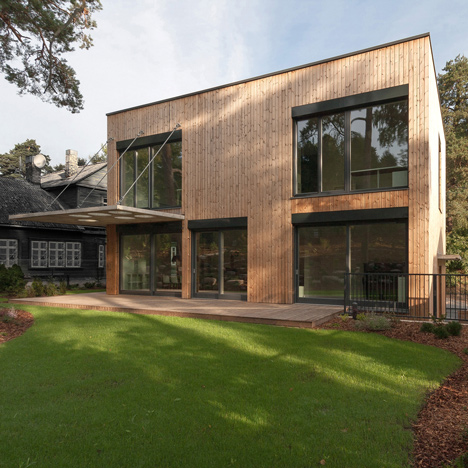Aketuri Architektai pairs a timber facade with a concrete canopy for House in Vilnius
