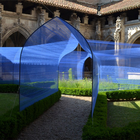 Atelier Yokyok installs vaulted string tunnels in a Gothic cloister garden