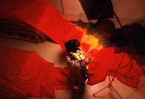 Artist Baker sewing a flag.