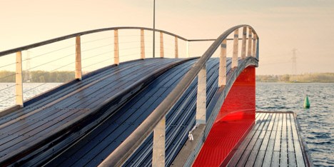 René van Zuuk creates a wavy pier with an integrated lightbox over an Almere lake