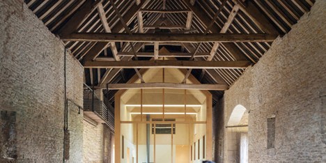 Private art gallery by Stonewood Design cantilevers into a 17th-century Cotswolds barn