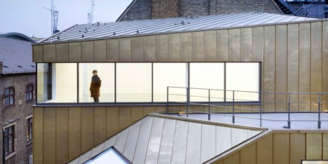 Shoreditch office by Piercy & Company has a restored facade and a golden behind