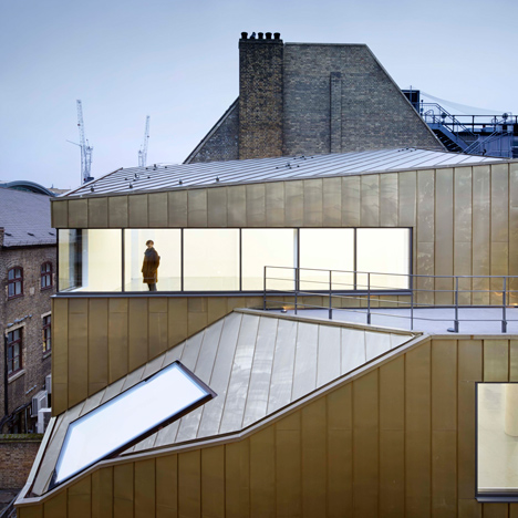 Shoreditch office by Piercy & Company has a restored facade and a golden behind