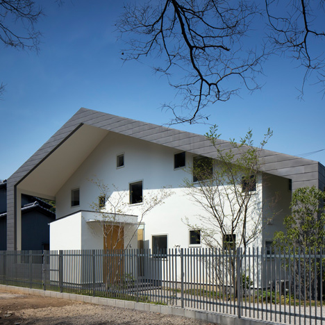 House in Wakayama by Spray shelters four triangular terraces beneath its wonky roof
