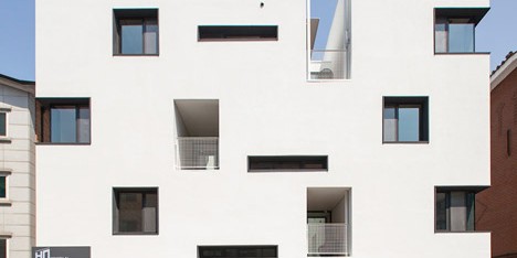 Seoul apartment block by Archihood WXY features tunnel-like balconies and gabled corners