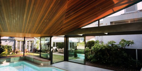 Origami Pool House by Made Group features a faceted timber ceiling