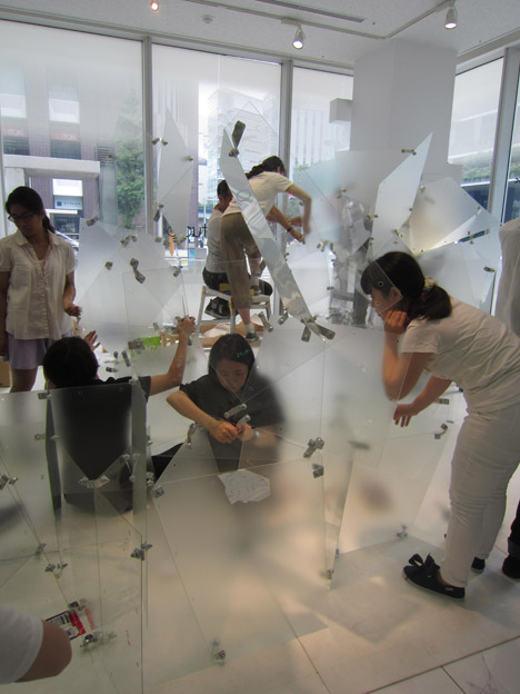 Students assembling Transparent Structures installation