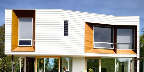 Tasmanian house extension by Preston Lane features faceted wooden window recesses