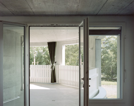 Concrete apartment building in Zellweger Park by Herzog and de Meuron