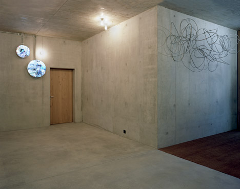 Concrete apartment building in Zellweger Park by Herzog and de Meuron