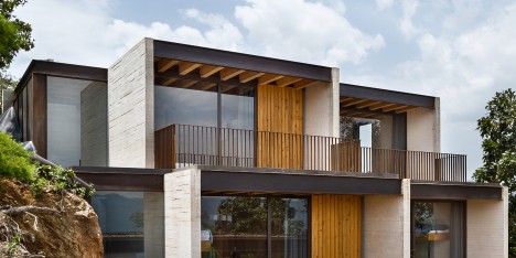 Concrete house in Mexico by Taller Hector Barroso cascades towards a lake