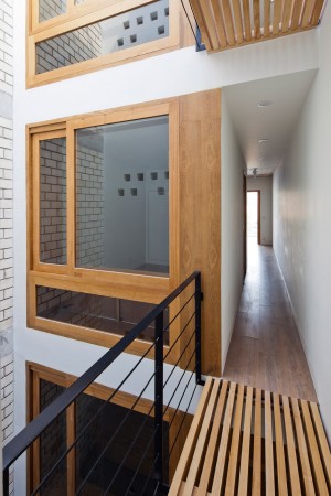 Townhouse with a folding-up shutter in Vietnam by MM++ Architects