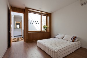 Townhouse with a folding-up shutter in Vietnam by MM++ Architects
