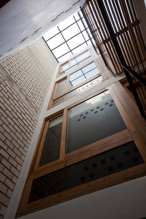 Townhouse with a folding-up shutter in Vietnam by MM++ Architects