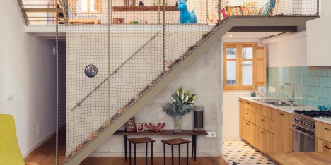 Nook Architects uses mesh to divide open-plan Barcelona house