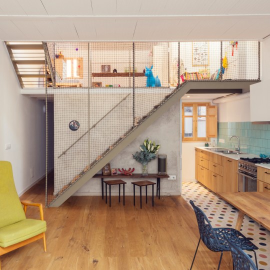 Nook Architects uses mesh to divide open-plan Barcelona house
