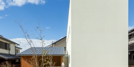 Maibara House by Alts Design Office combines a windowless block and a small garden pavilion