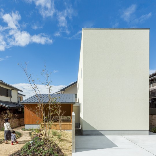 Maibara House by Alts Design Office combines a windowless block and a small garden pavilion