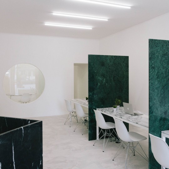 Fala Atelier adds green, grey and black marble inside Porto estate agents