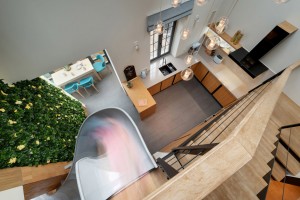 Apartment with a slide by KI Design Studio