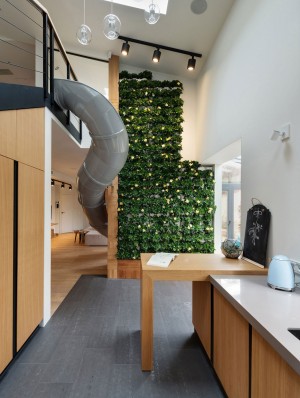 Apartment with a slide by KI Design Studio