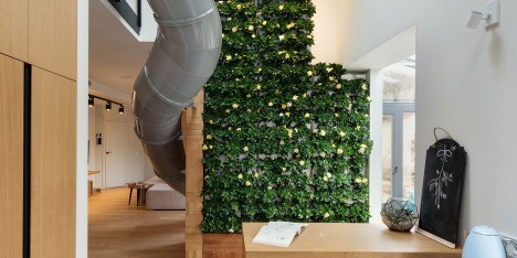 Apartment with a slide by KI Design Studio