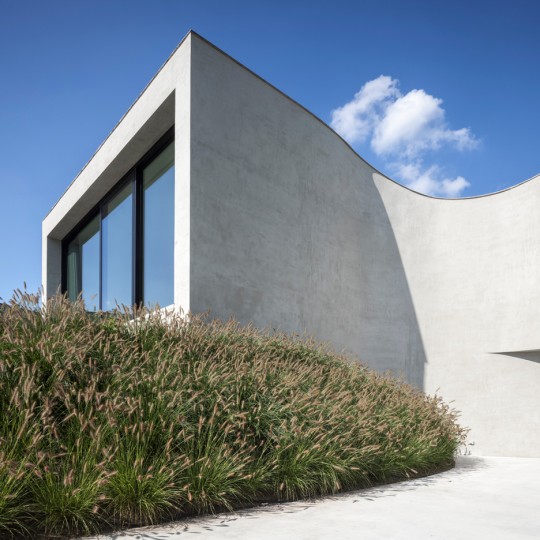 Office O Architects uses “flowing lines” and projecting windows to create Villa MQ