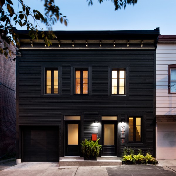 Architecture Open Form creates black facade for historic Montreal home
