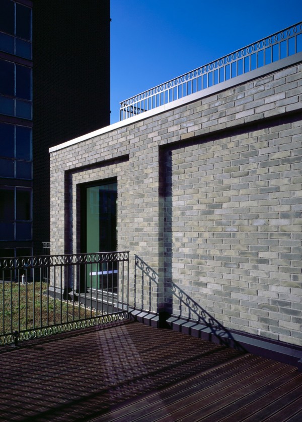 Photograph by Helene Binet Corner House by DSDHA residential mixed-use brick architecture London, UK