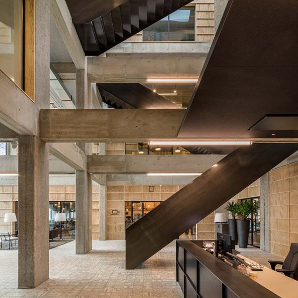 Studioninedots carves out an atrium inside overhauled 1970s office building