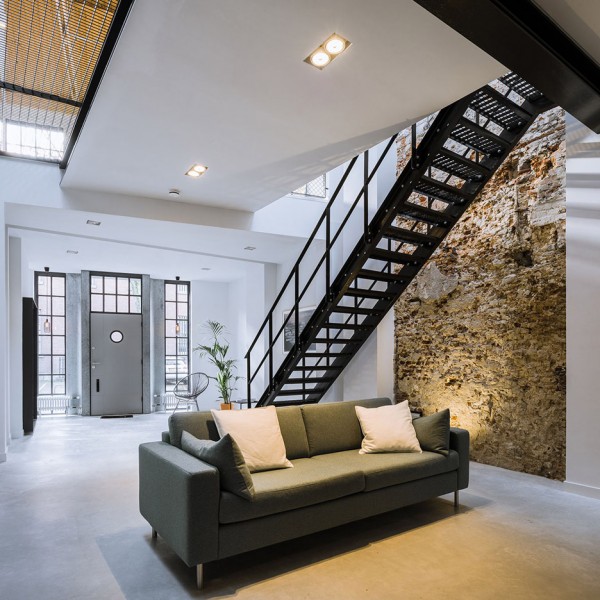 EVA converts former workshop into loft-inspired home for a Dutch couple